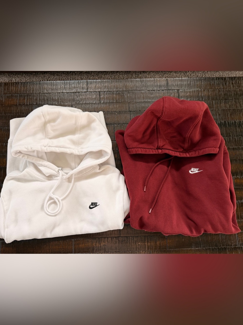 2 hooded Nike pullover sweatshirts.